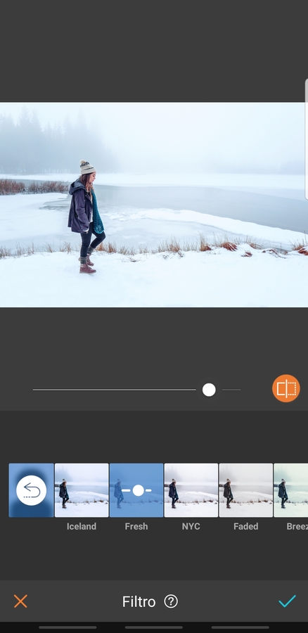 mujer en la montaña con nieve con ropa de invierno