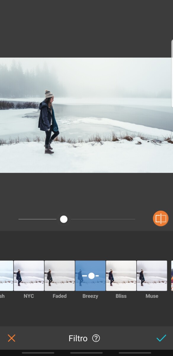 mujer en la montaña con nieve con ropa de invierno
