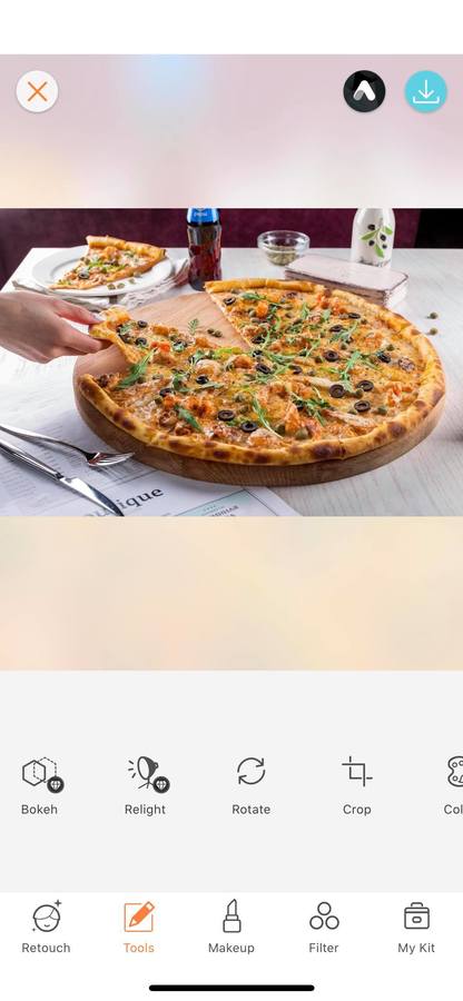 hand reaching for slice of pizza