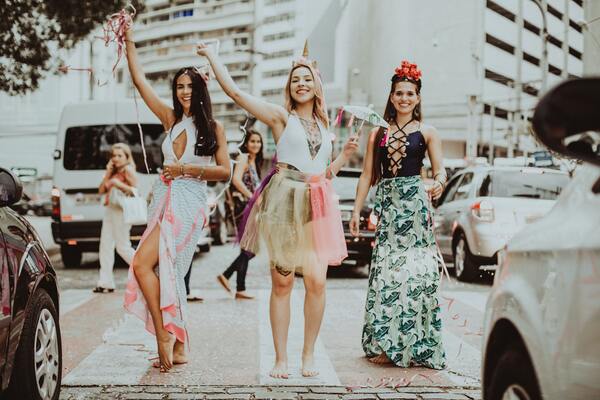 three women in a street parade