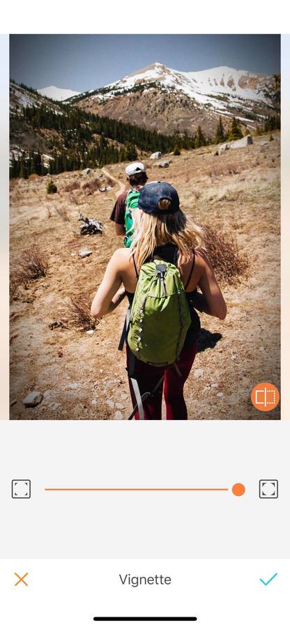 two people hiking in the hills