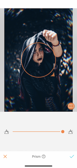 Picture of a woman holding a scarf up her head being edited by AirBrush with Prism