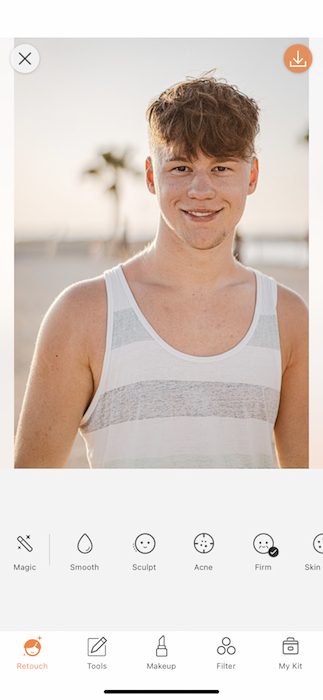 young man in white and grey tank top at the beach