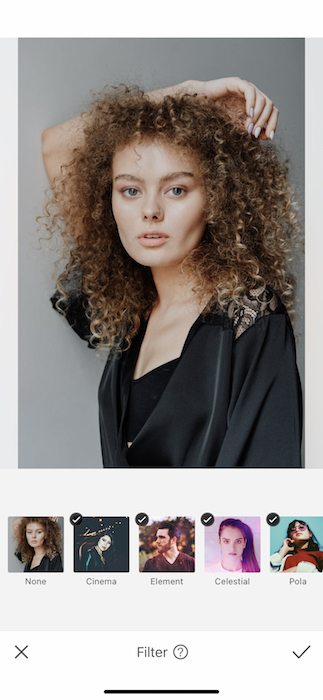picture white woman with curly hair being edited by AirBrush with filter