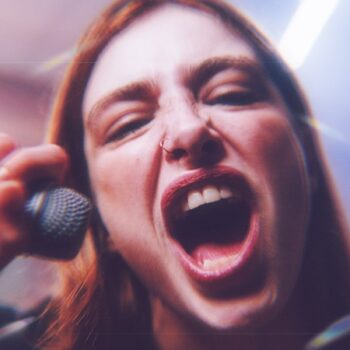 woman screaming into a microphone
