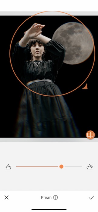 woman wearing a black dress standing in front of the moon