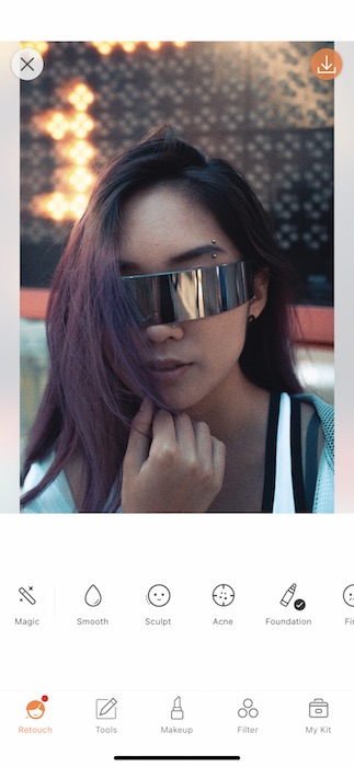 Picture of a woman with intergalactic glasses being edited by AirBrush with Retouch