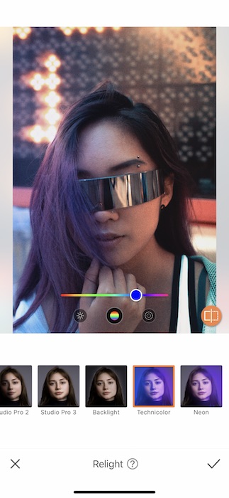 Picture of a woman with intergalactic glasses being edited by AirBrush with Relight