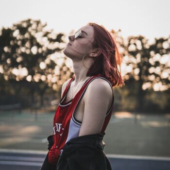 red hair girl in sports clothing