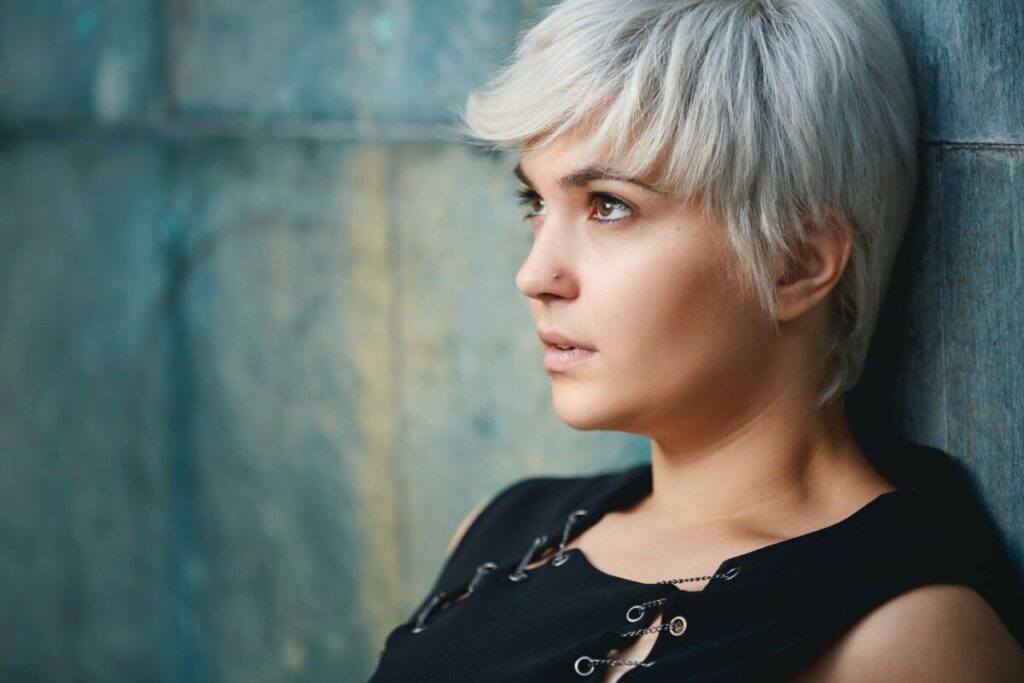 woman with blonde pixie cut hair