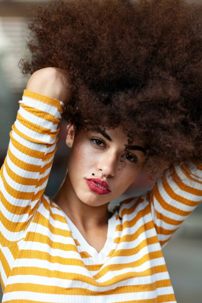 woman wearing yellow and white stripe t-shirt