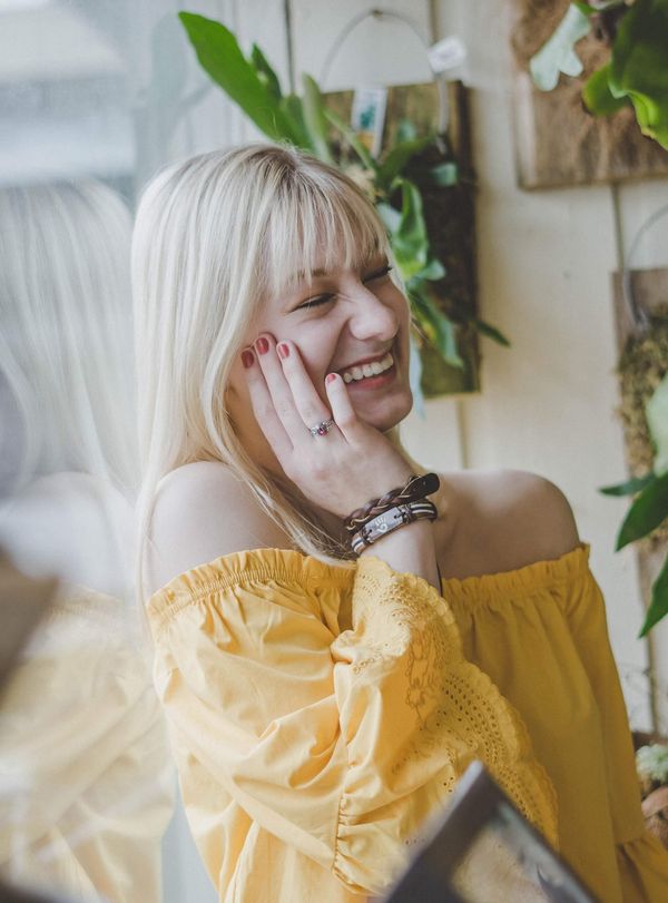 woman in yellow top laughing
