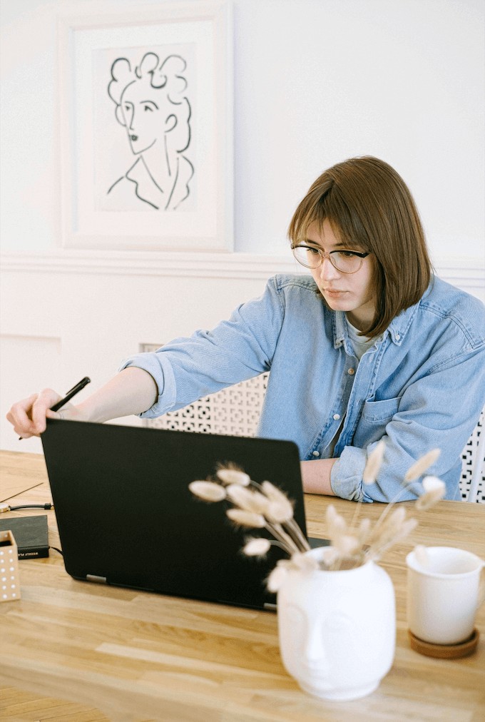 woman working at a computer for a business photoshoot