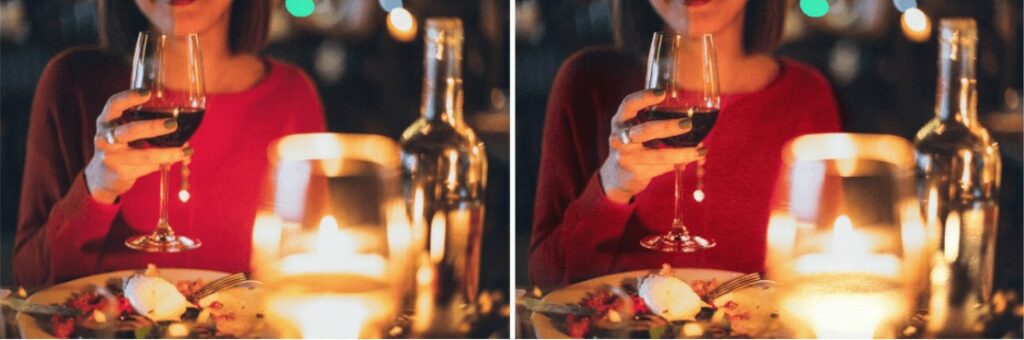 woman in red sweater holding a wine glass