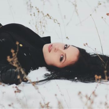 woman lying in the snow