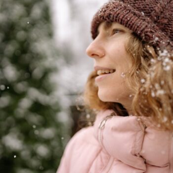 woman in beanie outside in snow