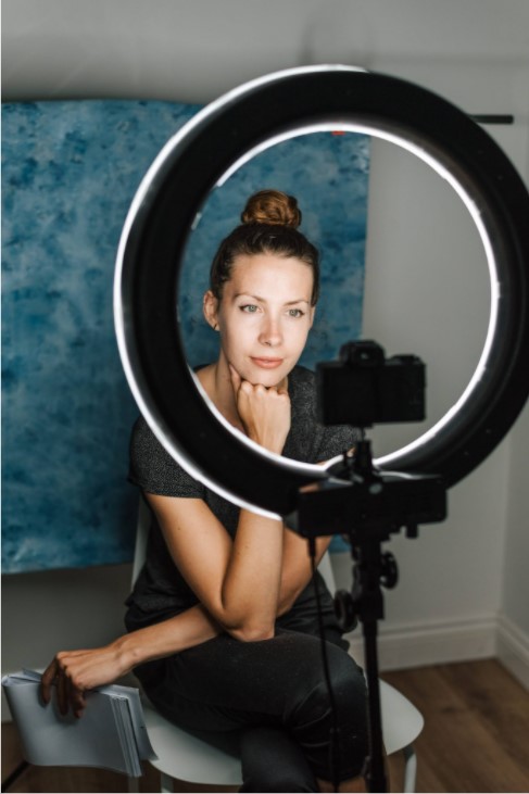 woman in front of ring light