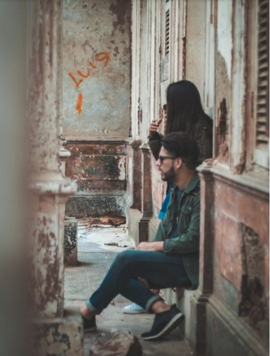 man and woman in an alley