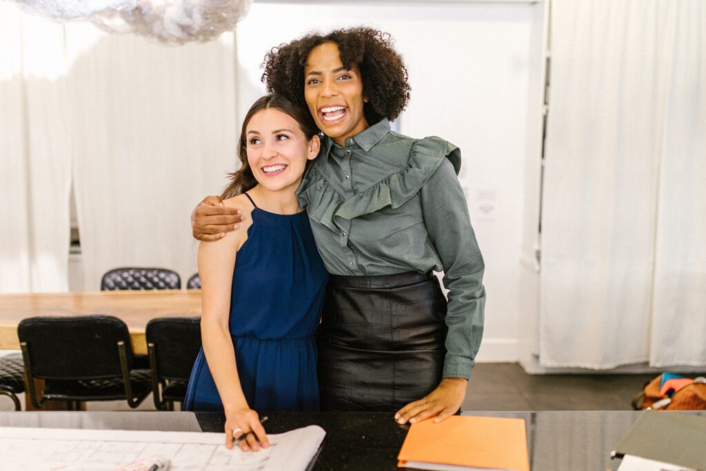 woman hugging another woman